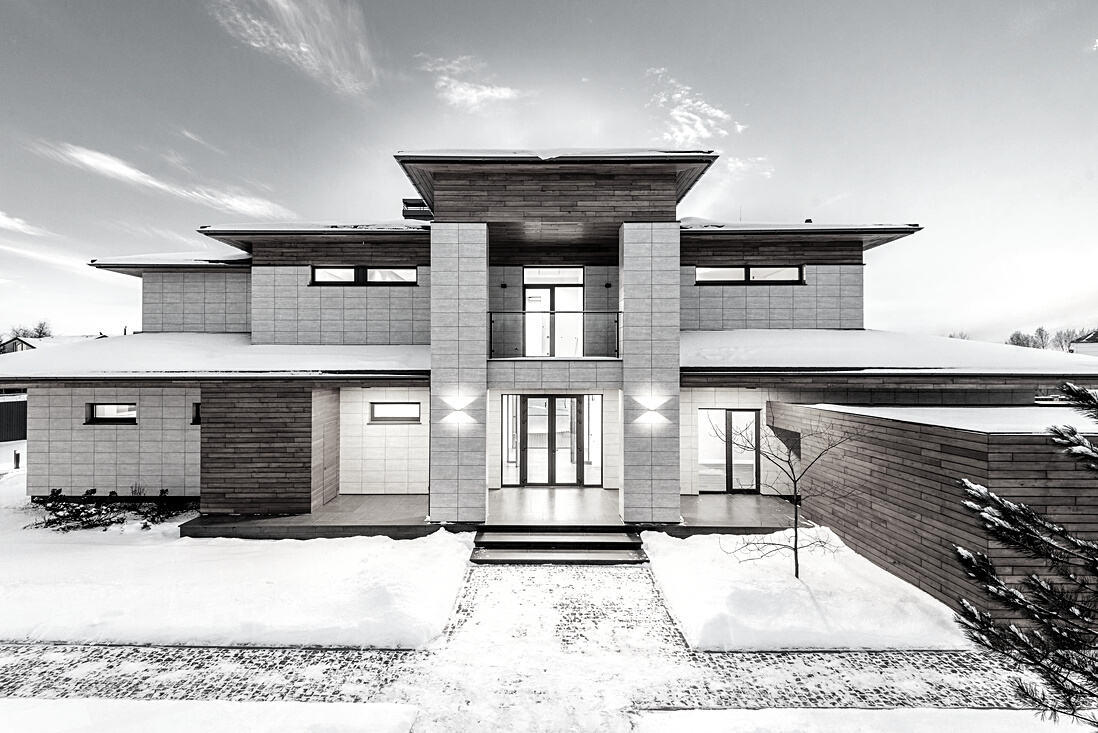 Contemporary country house facade in winter