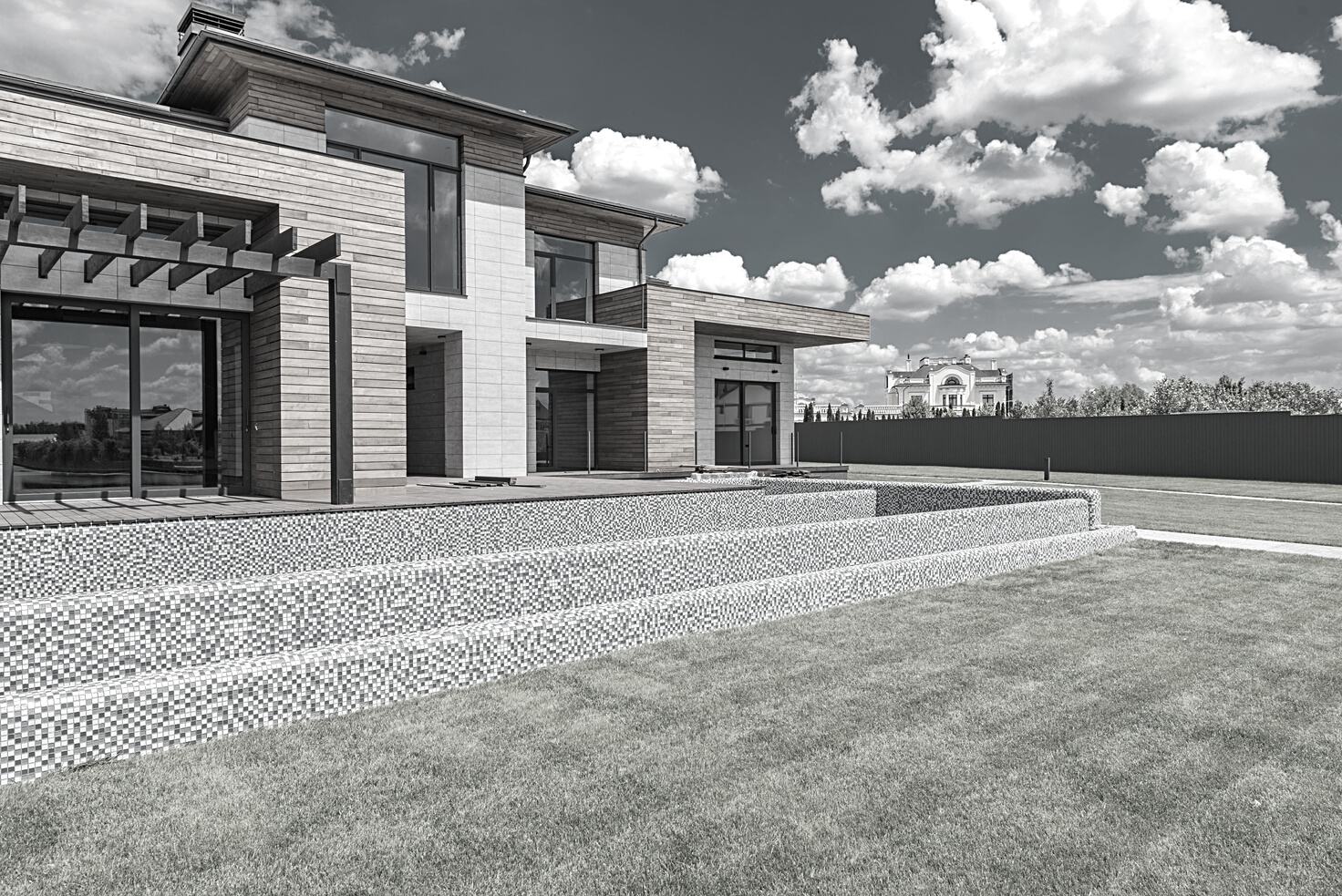 Courtyard of modern villa with glass walls